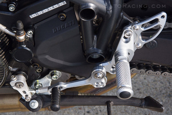 You can switch from stock shift to reverse shift pattern by rotating the shift arm.